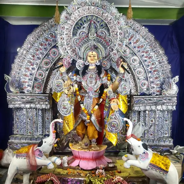 Sacred Maa Gaja Laxmi clay idol seated in Padmasana with twin royal elephants and silver filigree backdrop