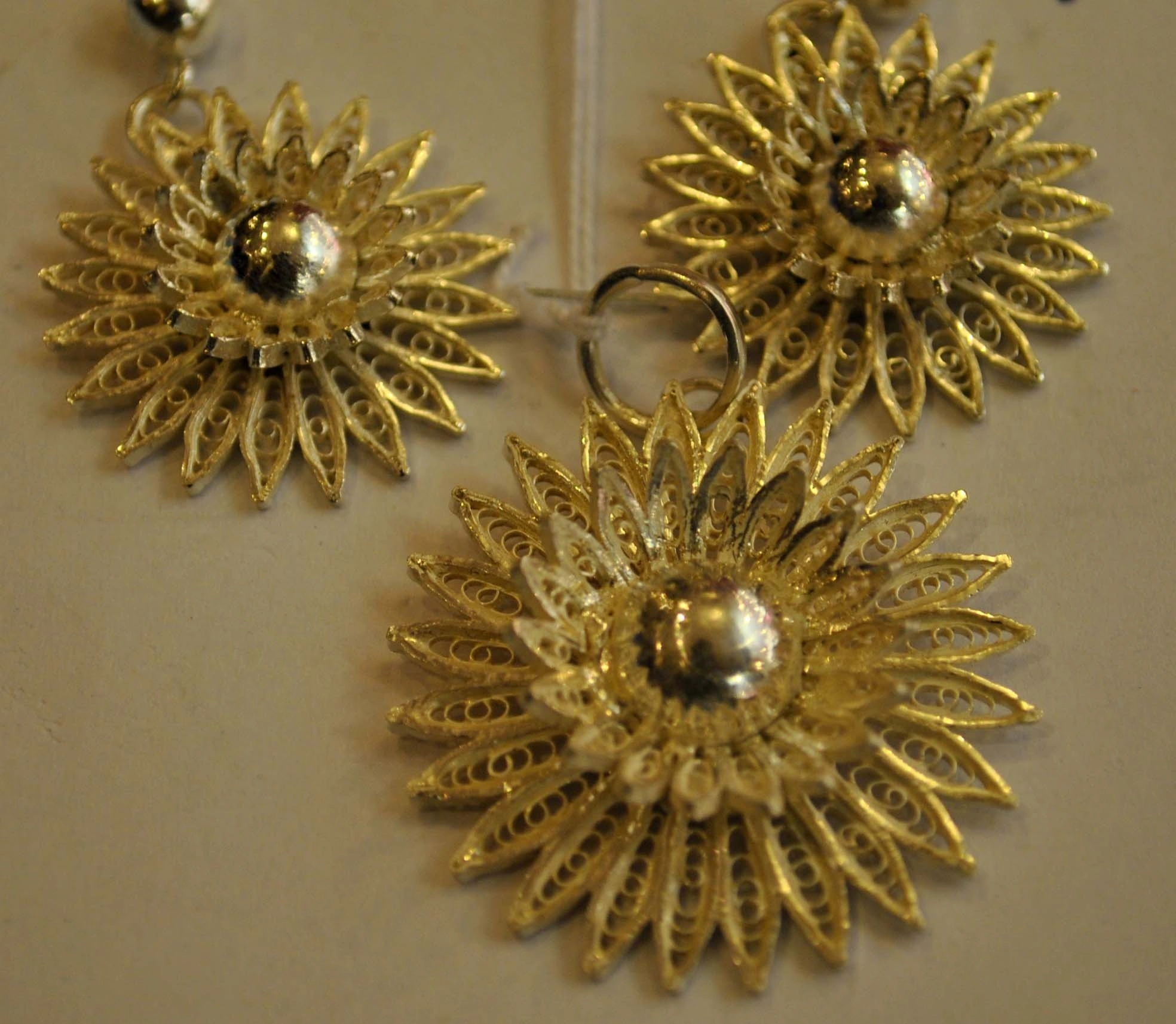 Macro view of authentic Kataka Tarakasi silver filigree craft showing intricate wire drawing and metalwork
