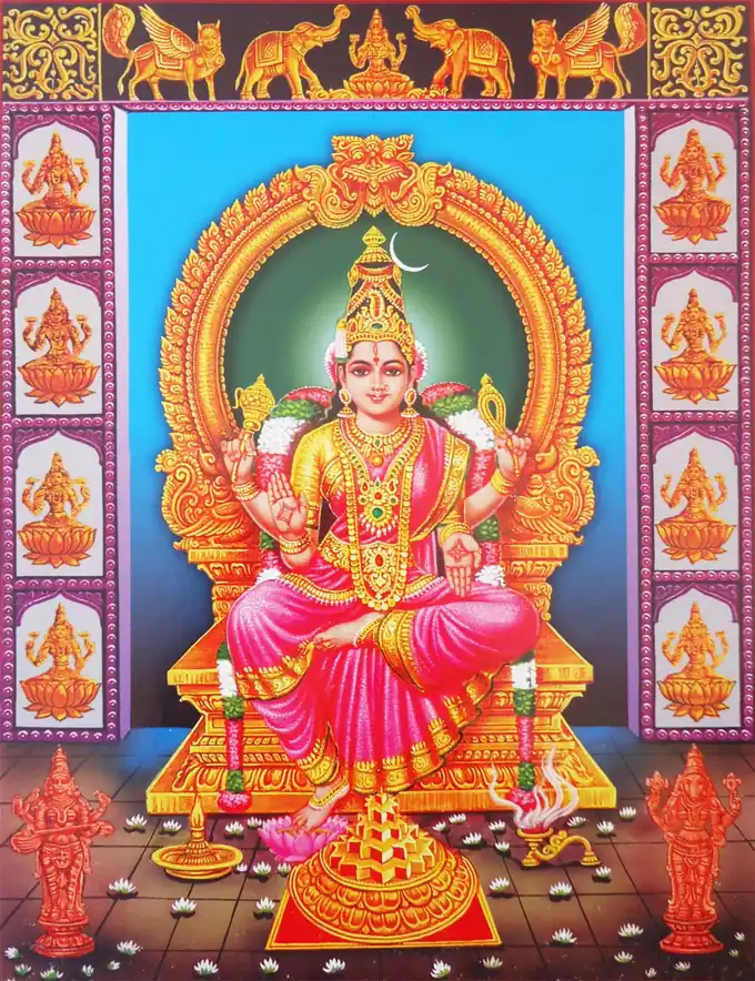 Goddess Bhubaneshwari cosmic queen seated on golden throne with crescent moon holding noose and goad with Sri Yantra, the fourth Dasha Mahavidya | localdrive